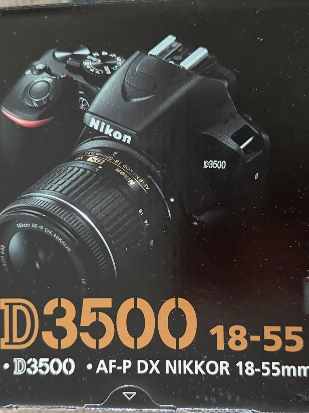Nikon Black DSLR with 18-55mm Lens and Branded Strap